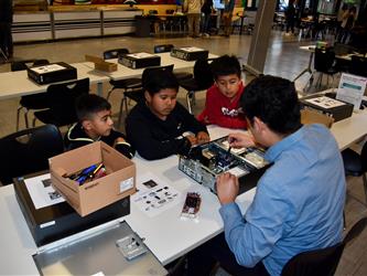 Students taking apart a computer