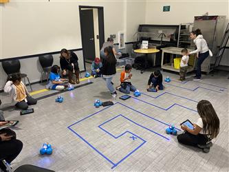 Students using Dash robots