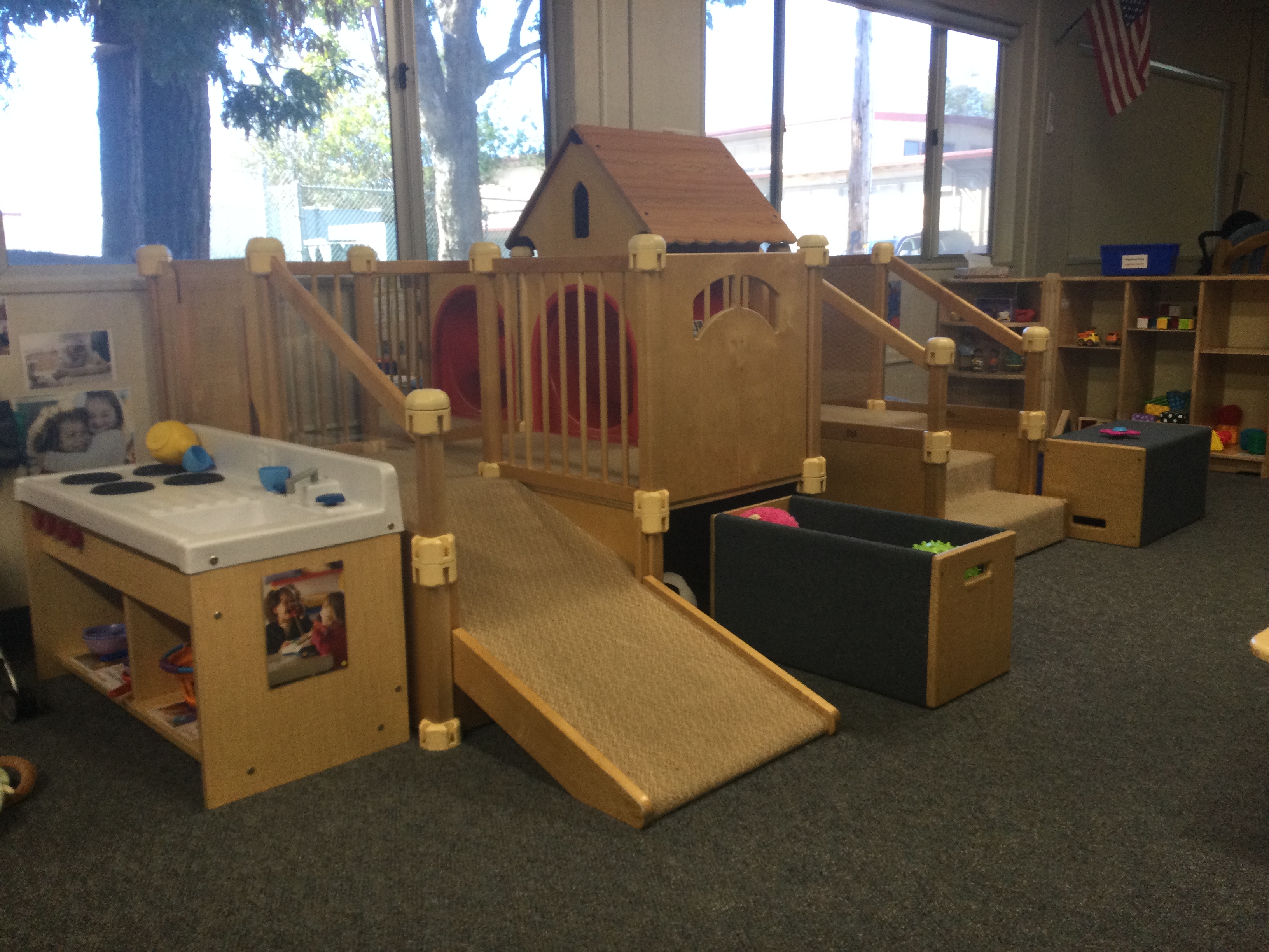 Wooden infant play structure in classroom 